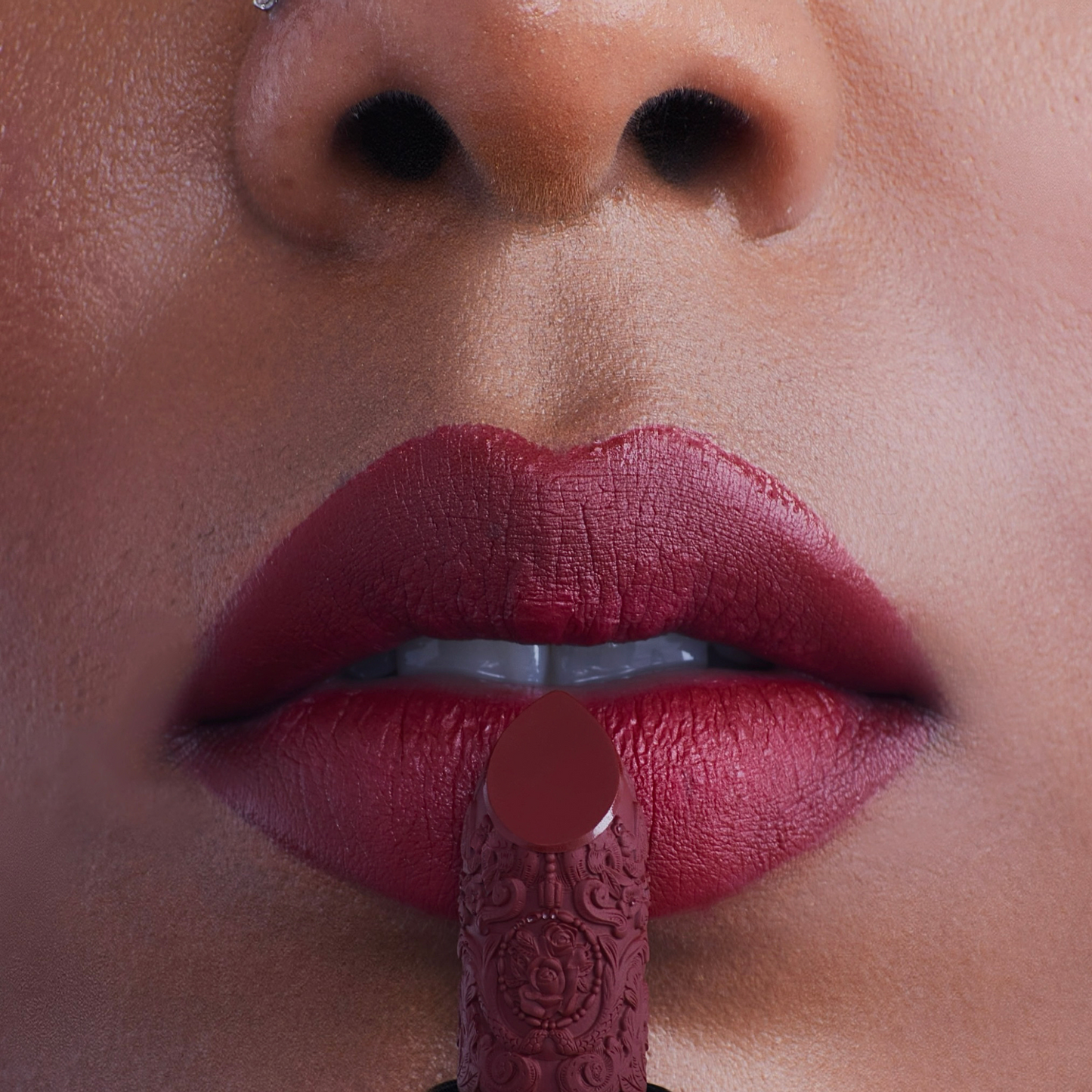 Deep red lipstick for dark skin