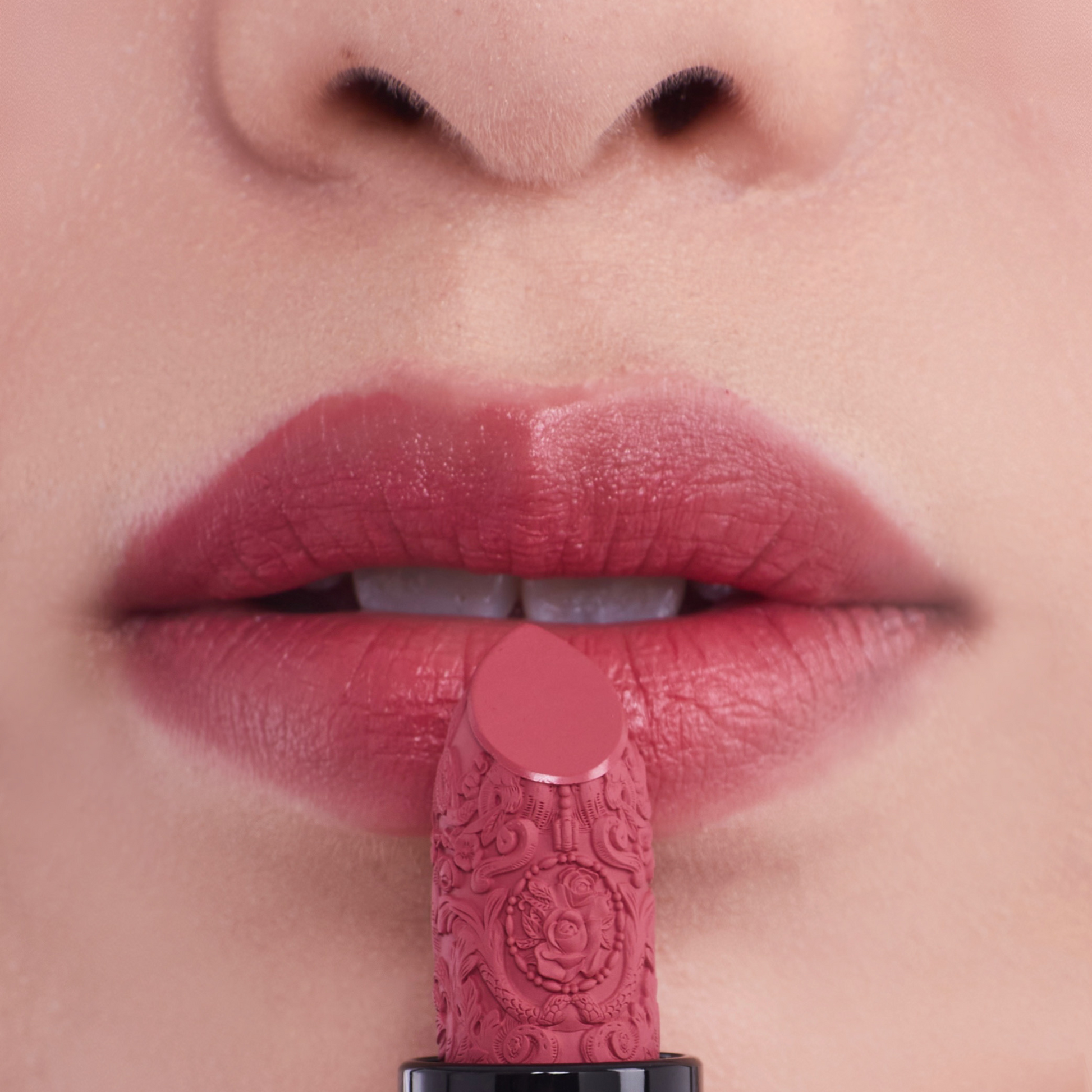 Nude pink carved lipstick on the mounth 2